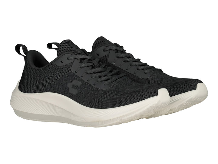Tenis deportivos Charly color negro con suela blanca y tejido transpirable.