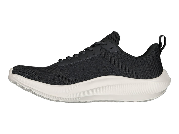 Tenis deportivos Charly color negro con suela blanca y tejido transpirable.
