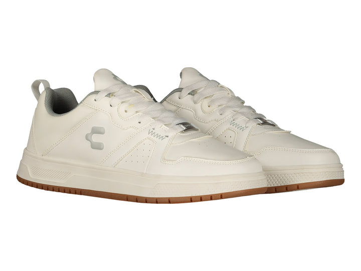 Tenis deportivos Charly de color blanco con suela marrón, vista lateral.