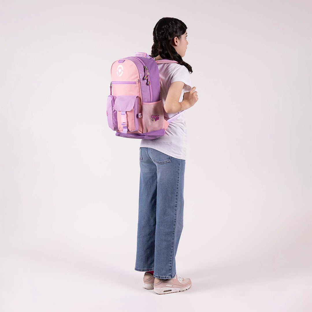 Mochila escolar Chenson Happy Girl en colores morado y rosa con múltiples compartimentos y detalles decorativos.