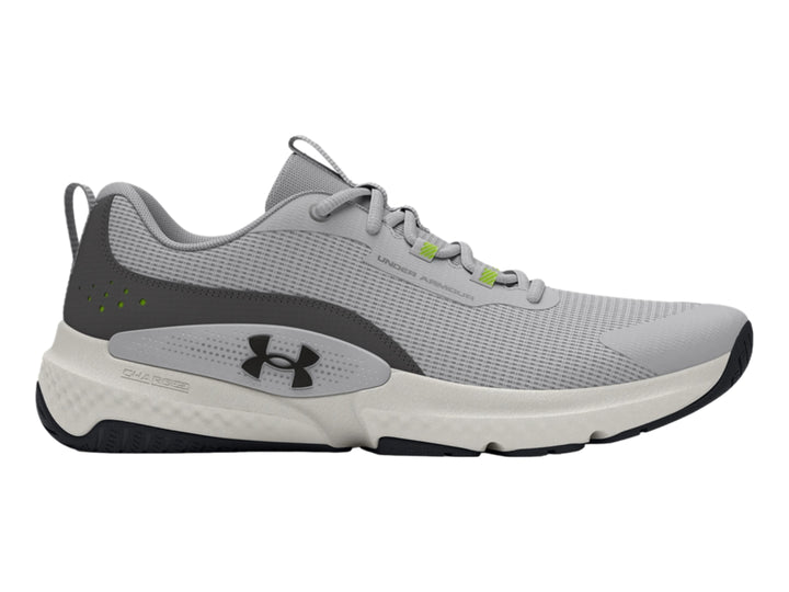 Tenis deportivos Under Armour en color gris con suela blanca y detalles en verde y negro.