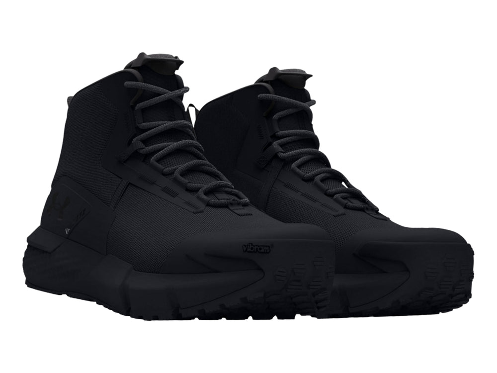 Botín deportivo Under Armour Charged Valsetz Mid en color negro con suela robusta y corte medio.