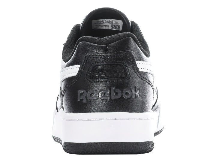 Tenis deportivos Reebok en color negro con detalles y suela en blanco.