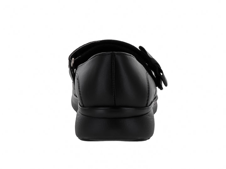 Zapato negro para niña estilo Mary Jane con correa y suela dentada.