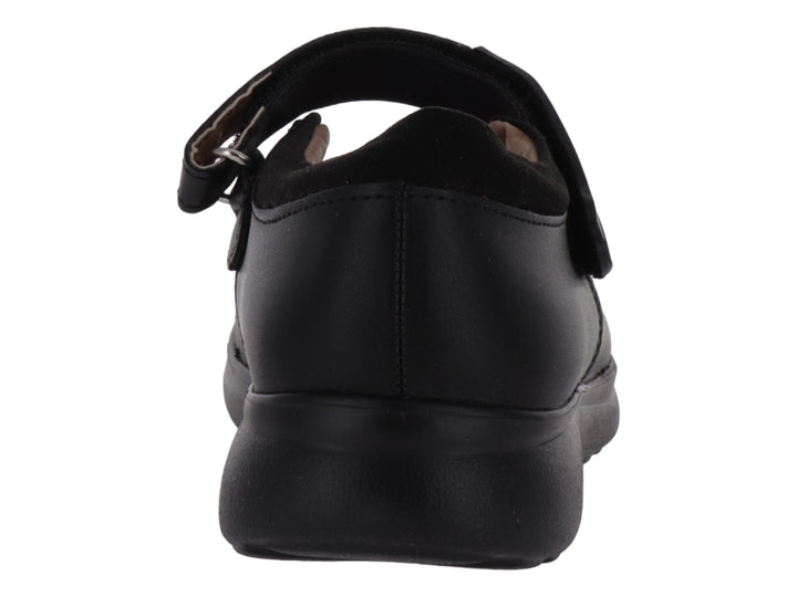 Zapato infantil VAVITO color negro con correa de cierre y detalles de pequeños corazones blancos.