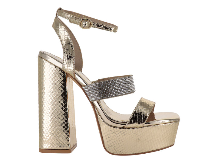 Sandalia de mujer color oro con tacón grueso, plataforma y correa al tobillo con detalles brillantes.