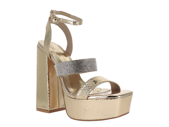 Sandalia de mujer color oro con tacón grueso, plataforma y correa al tobillo con detalles brillantes.