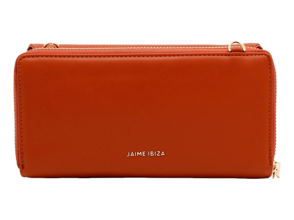Bolso estilo cartera color caramelo de la marca Jaime Ibiza con correa y detalles en dorado.