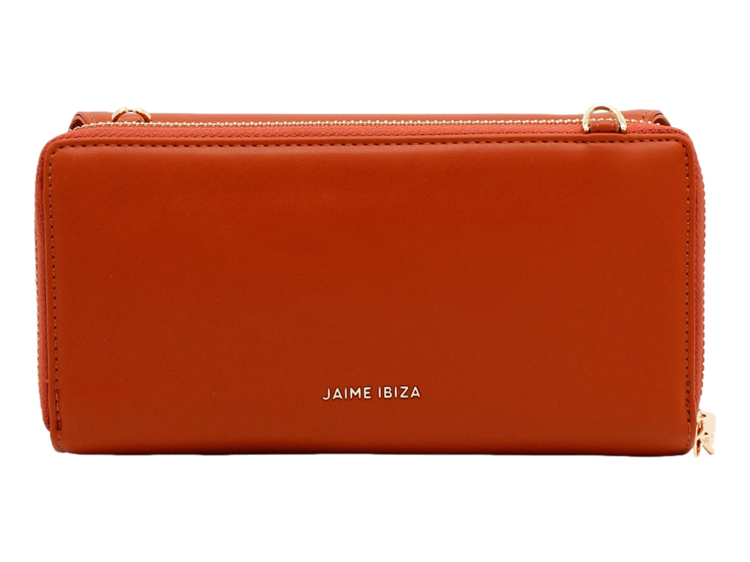 Bolso estilo cartera color caramelo de la marca Jaime Ibiza con correa y detalles en dorado.