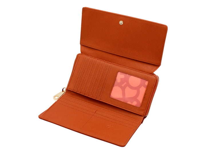 Bolso estilo cartera color caramelo de la marca Jaime Ibiza con correa y detalles en dorado.