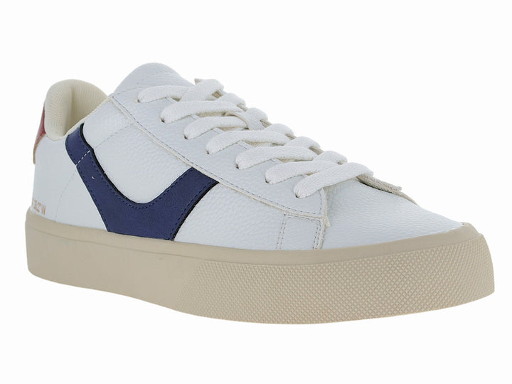 Tenis blancos con franja azul lateral, detalle rojo en el talón y suela beige.
