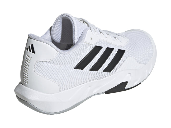 Tenis de entrenamiento Adidas Amplimove en color blanco con tres franjas negras laterales y suela blanca.