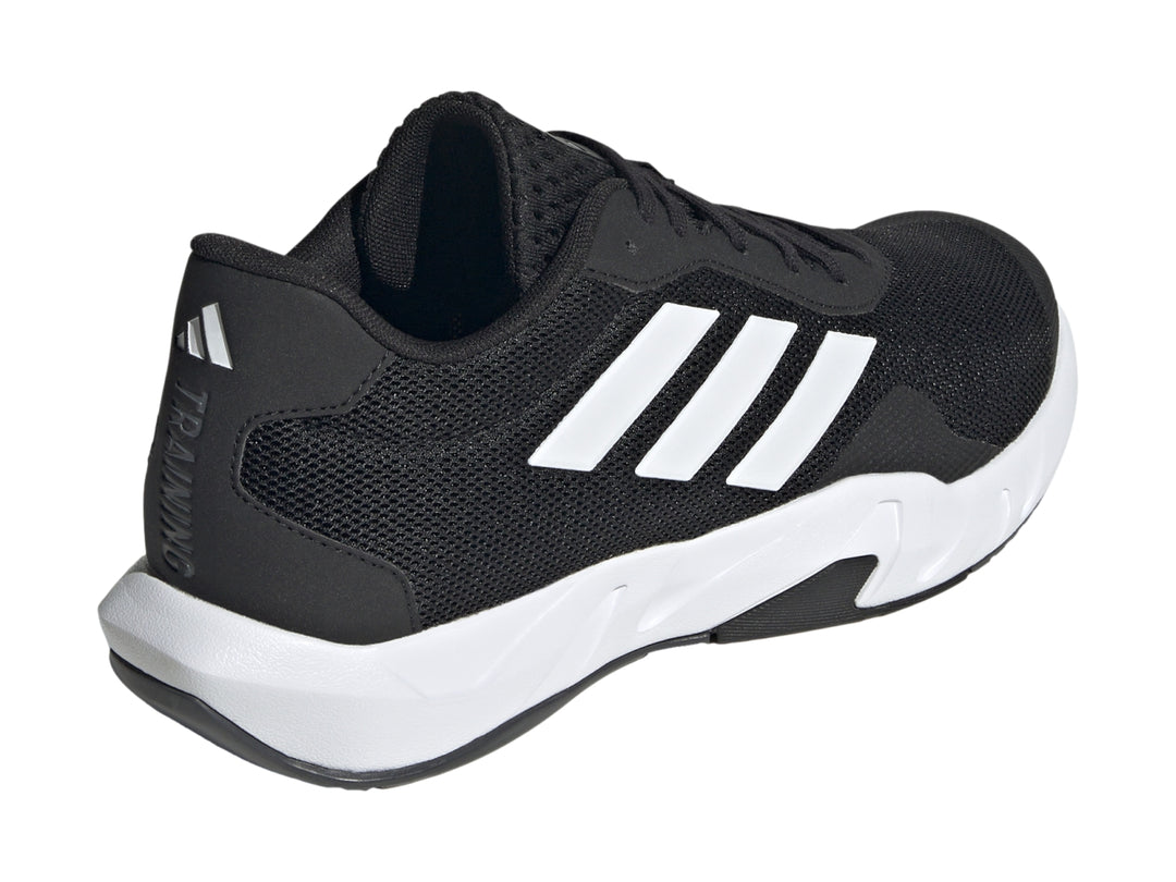 Tenis Adidas Amplimove en color negro con tres franjas blancas laterales y suela blanca.