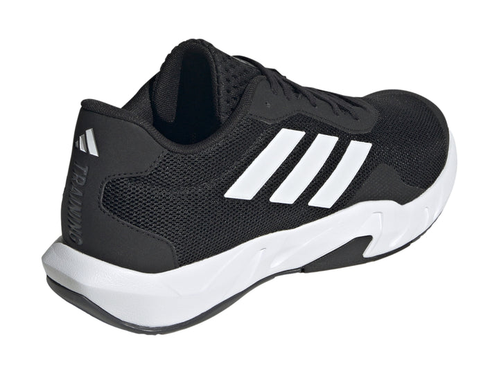 Tenis Adidas Amplimove en color negro con tres franjas blancas laterales y suela blanca.