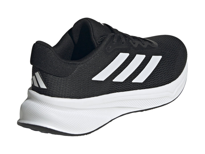 Tenis deportivos Adidas Response en color negro con suela y franjas laterales en blanco.