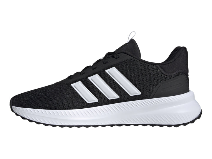 Tenis deportivos Adidas color negro con franjas y suela blanca.