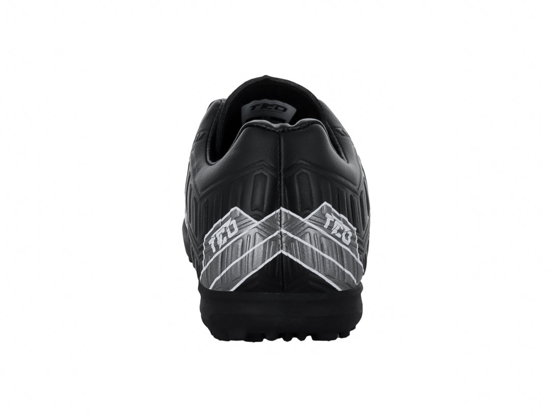 Zapato de fútbol Leon Trucco negro con detalles gráficos en blanco y suela para pasto sintético