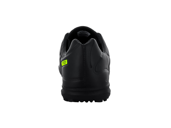 Zapato de fútbol Leon Trucco color negro con detalles en amarillo neón y suela para pasto sintético.
