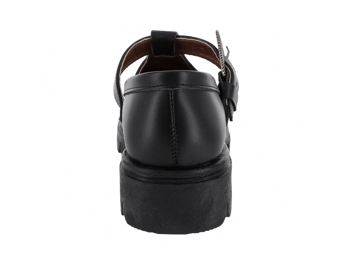 Zapato plano negro estilo Mary Jane con suela track y hebilla decorativa plateada.