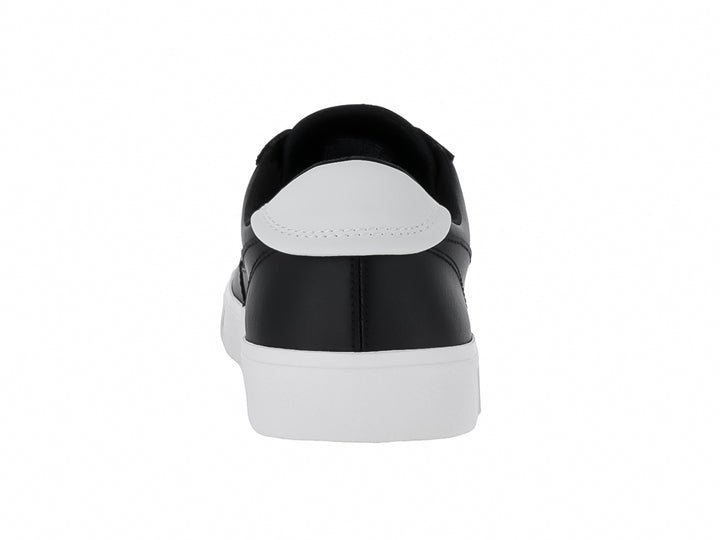 Tenis Tommy Hilfiger de color negro con suela y agujetas blancas, estilo casual.