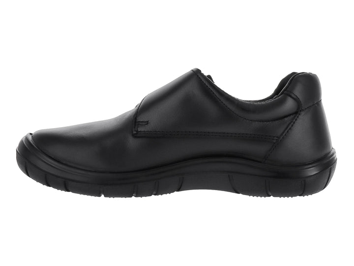 Zapato negro para niño o niña con cierre de velcro y suela cómoda sobre fondo blanco.