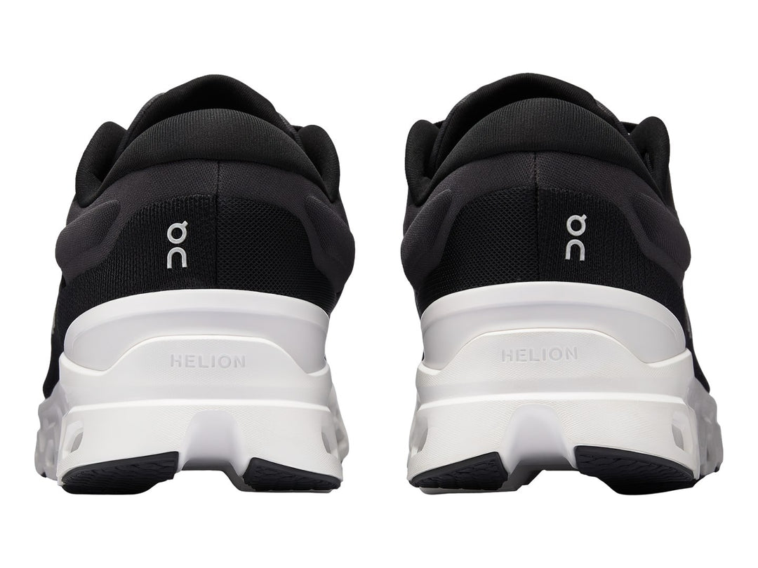 Tenis deportivos On Cloudstratus 3 color negro con suela blanca y diseño ergonómico.