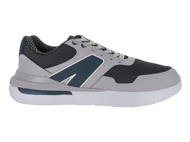 Tenis deportivos infantiles en colores gris y azul marino con suela blanca y cordones.