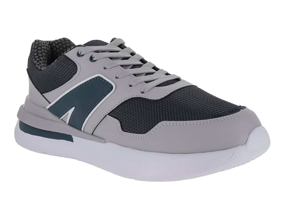 Tenis deportivos infantiles en colores gris y azul marino con suela blanca y cordones.