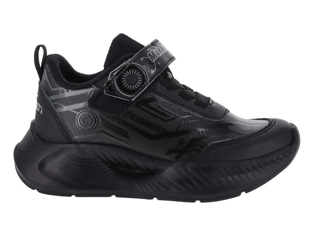 Tenis deportivos infantiles de color negro con suela gruesa y correa de ajuste.
