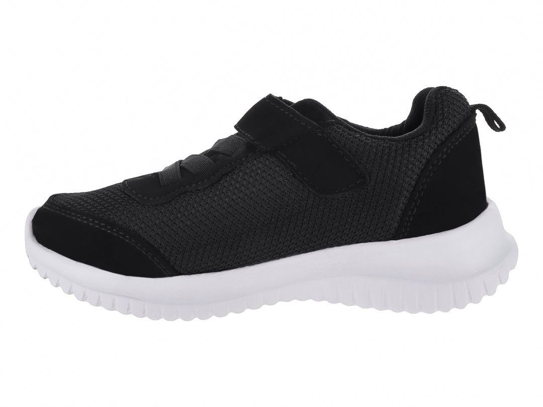 Zapato deportivo infantil color negro con suela blanca y cierre de velcro.