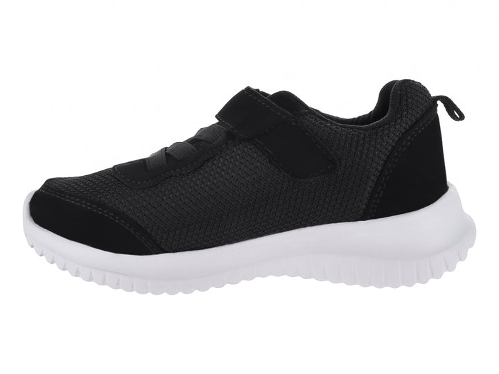 Zapato deportivo infantil color negro con suela blanca y cierre de velcro.