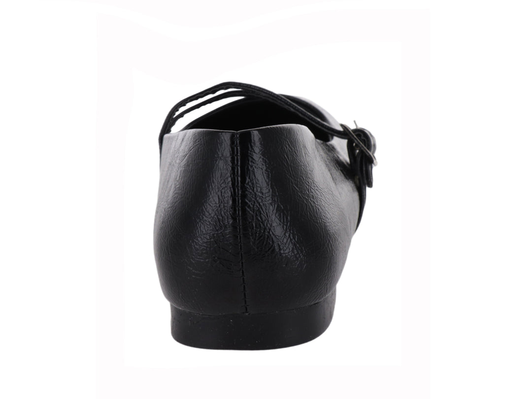 Zapato plano negro para niña con doble correa y hebillas plateadas sobre fondo blanco.