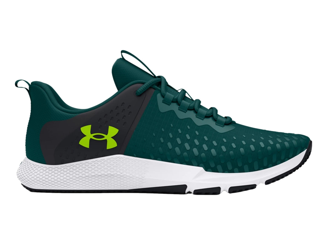 Tenis deportivos Under Armour color azul oscuro con suela blanca y detalles en verde lima.