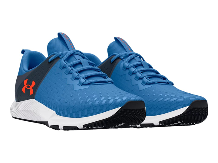 Tenis deportivos Under Armour en color azul y gris con suela blanca y detalles en negro.