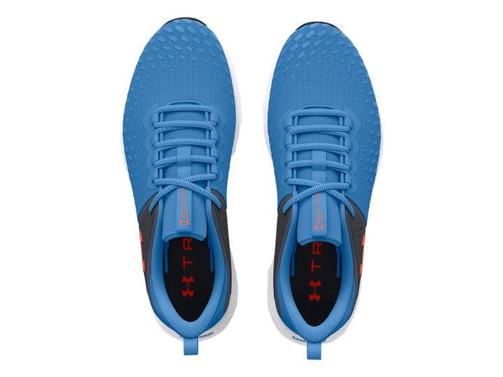 Tenis deportivos Under Armour en color azul y gris con suela blanca y detalles en negro.