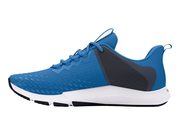 Tenis deportivos Under Armour en color azul y gris con suela blanca y detalles en negro.
