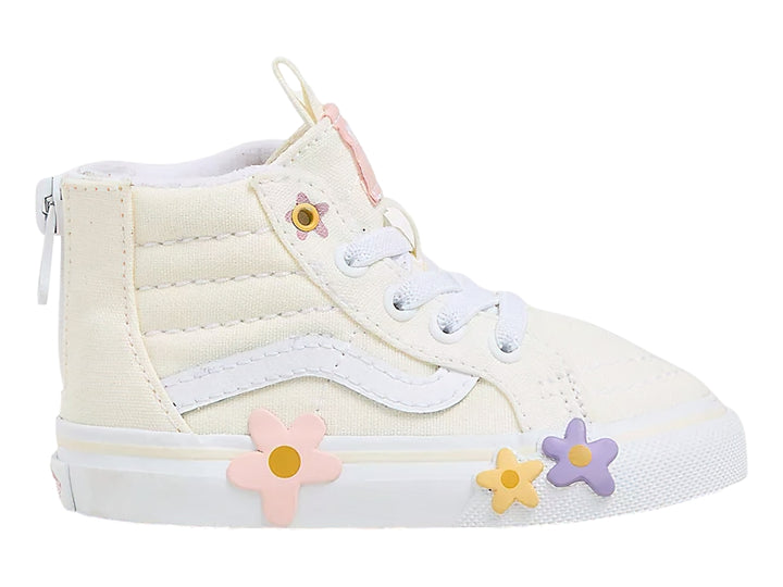Tenis Vans Sk8-Hi color blanco hueso con aplicaciones de flores coloridas y cierre lateral.