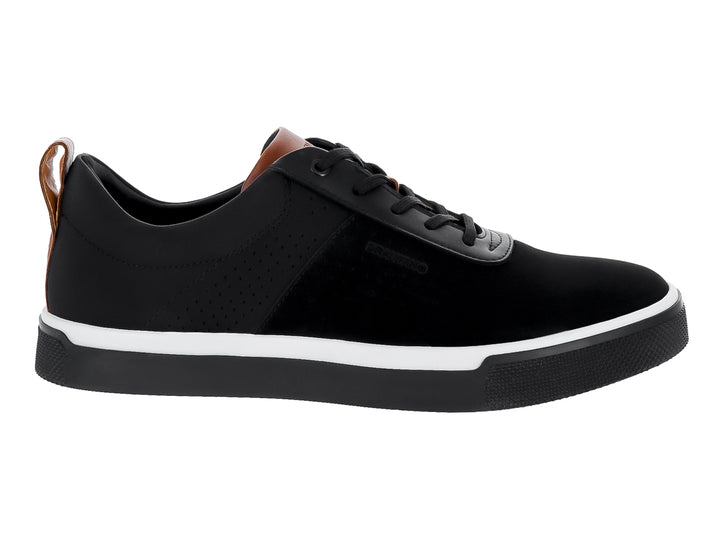 Zapato casual negro con suela blanca y detalles cafés en el talón y la lengüeta.