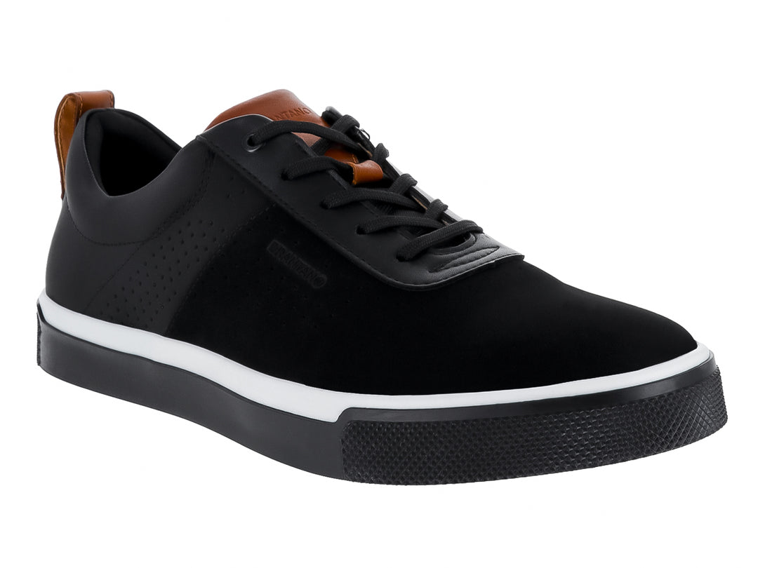 Zapato casual negro con suela blanca y detalles cafés en el talón y la lengüeta.