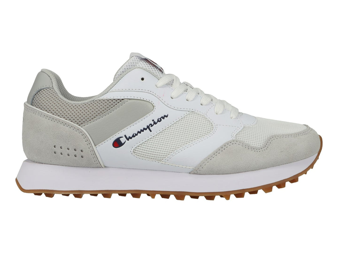 Tenis deportivos Champion en color blanco y gris con suela de goma café y detalles en malla.
