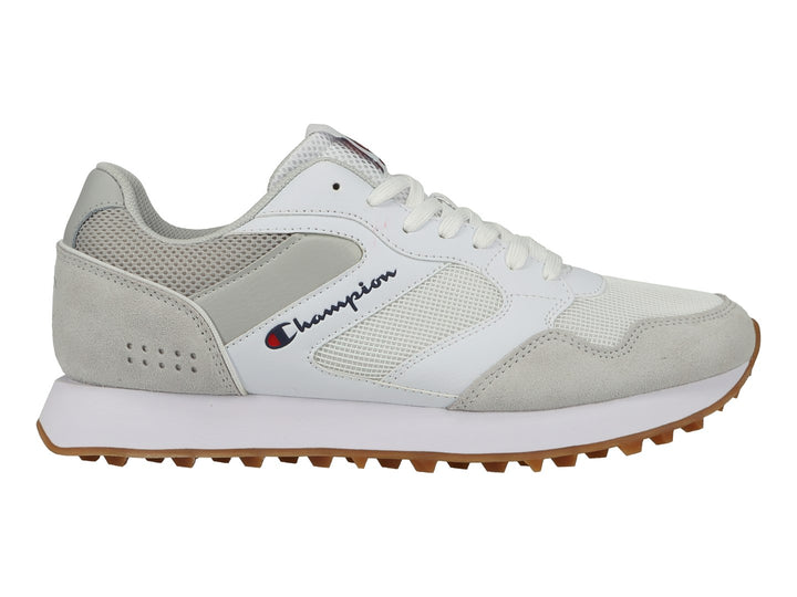 Tenis deportivos Champion en color blanco y gris con suela de goma café y detalles en malla.