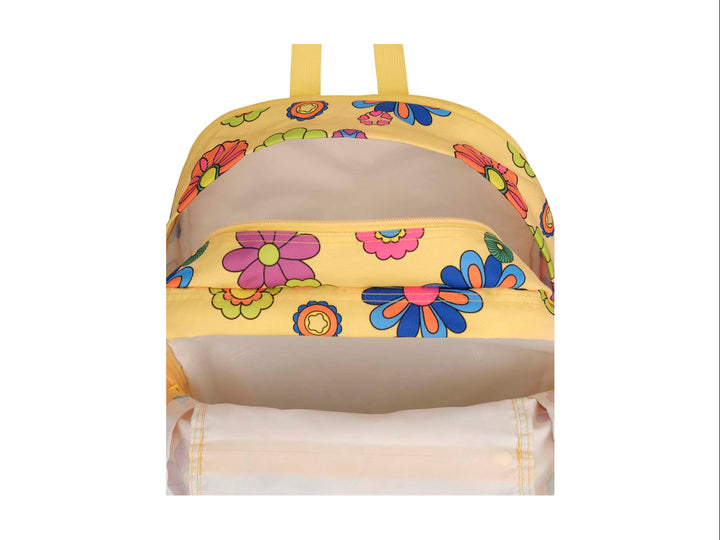 Mochila JanSport amarilla con estampado de flores multicolores en estilo retro y bolsillo frontal.