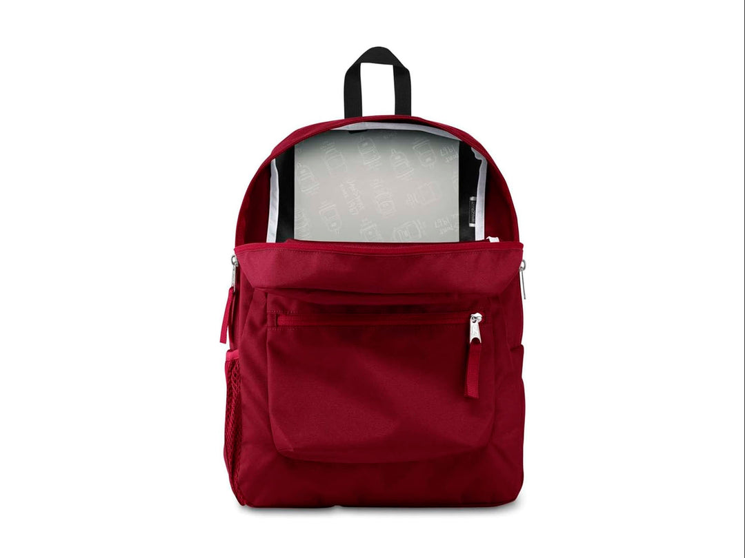 Mochila escolar JanSport color rojo russet con un bolsillo frontal y asa superior negra.