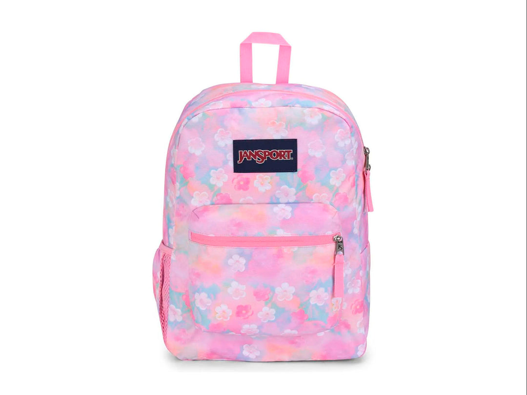 Mochila JanSport modelo Cross Town con estampado de flores en tonos rosa, azul y amarillo pastel.