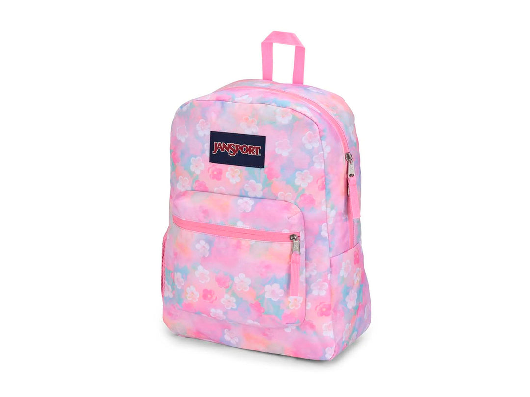 Mochila JanSport modelo Cross Town con estampado de flores en tonos rosa, azul y amarillo pastel.