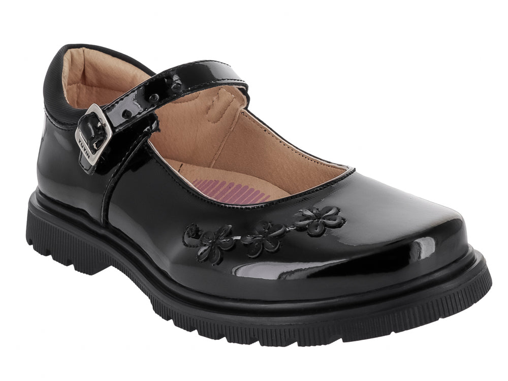 Zapato negro de charol para niña con detalles de flores en la punta y suela track.