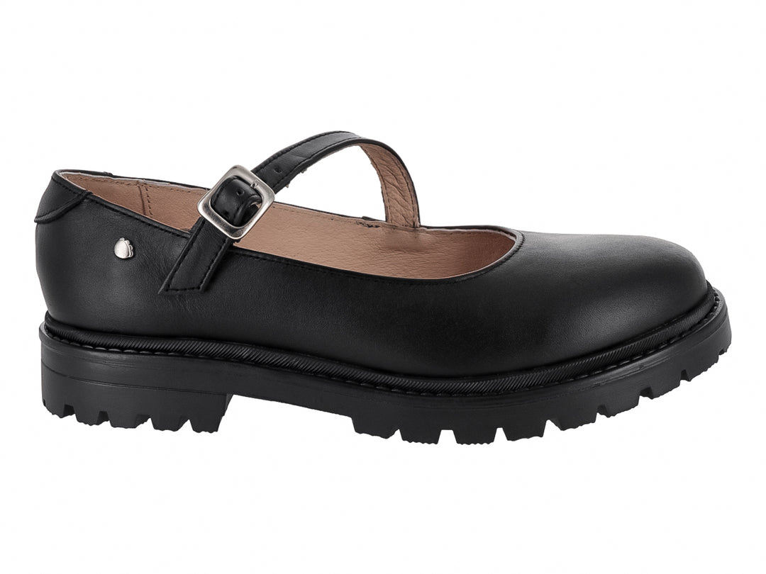 Zapato infantil Mary Jane de cuero negro con correa, hebilla plateada y suela gruesa dentada.
