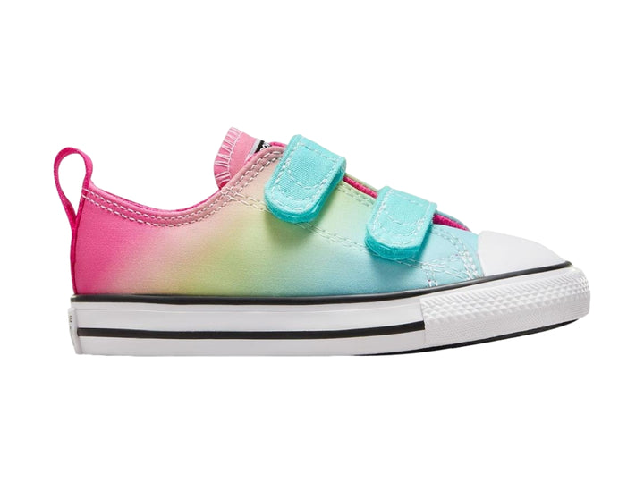 Tenis Converse Chuck Taylor All Star para niño o niña con diseño degradado multicolor y cierre de velcro blanco.