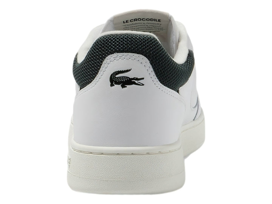 Tenis Lacoste blancos de cuero con detalles en verde oscuro y suela blanca.
