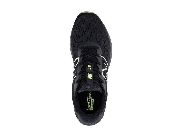 Tenis deportivos New Balance color negro con suela verde lima y logotipo blanco lateral.